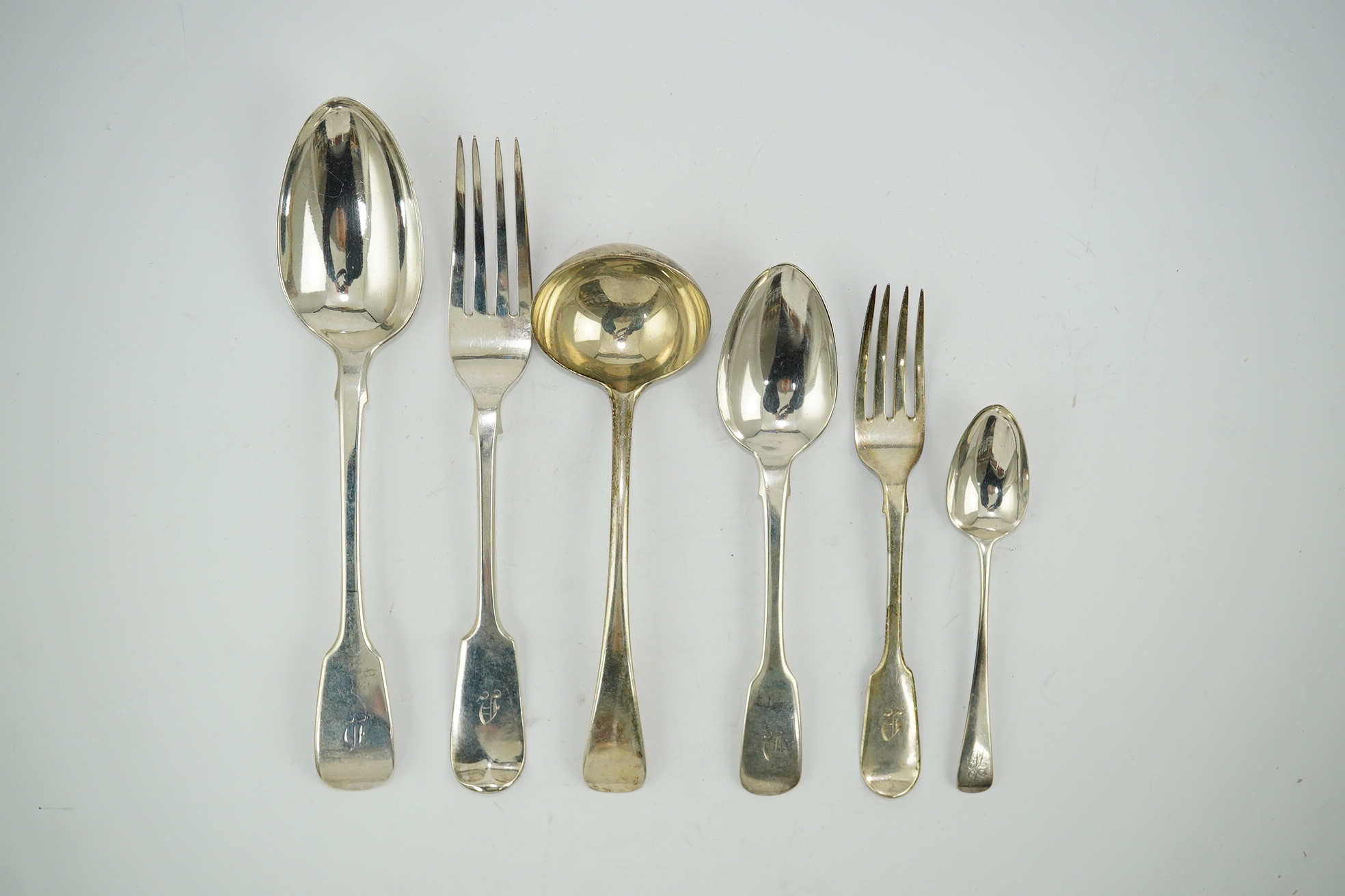 A quantity of assorted mainly 19th century flatware, various patterns, dates and makers including a set of six fiddle pattern table forks by John Stone, Exeter, 1859